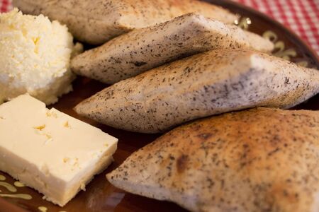 Cheese and bread on table