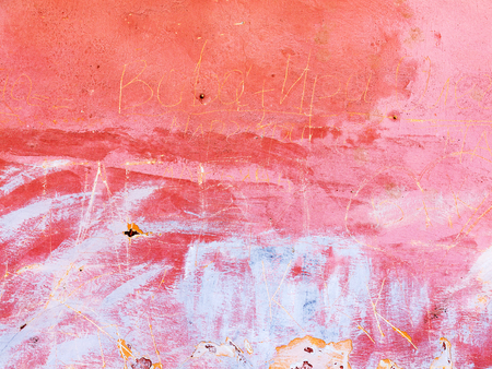 Grungy concrete surface with cracks, scratches and streaks of paintのeditorial素材
