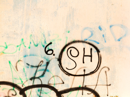 ODESSA - NOVEMBER 1: Detail of graffiti on the wall of the old building. Grungy concrete surface with cracks, scratches and streaks of paint. November 1, 2015 in Odessa, Ukraineのeditorial素材