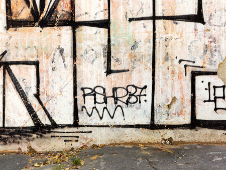 ODESSA - NOVEMBER 1: Detail of graffiti on the wall of the old building. Grungy concrete surface with cracks, scratches and streaks of paint. November 1, 2015 in Odessa, Ukraineのeditorial素材