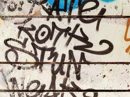 VARNA - NOVEMBER 13: Detail of graffiti on the wall of the old building. Grungy concrete surface with cracks, scratches and streaks of paint. November 13, 2015 in Varna, Bulgariaのeditorial素材