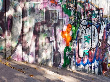 VARNA - NOVEMBER 13: Detail of graffiti on the wall of the old building perspective. Grungy concrete surface with cracks, scratches and streaks of paint. November 13, 2015 in Varna, Bulgariaのeditorial素材