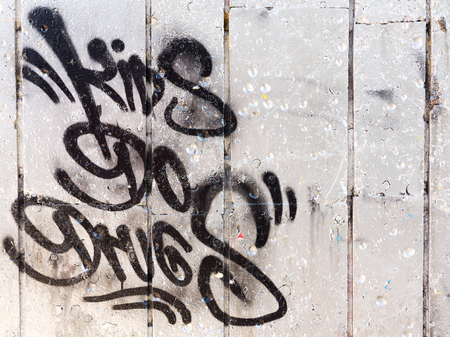 VARNA - NOVEMBER 13: Detail of graffiti on the wall of the old building. Grungy concrete surface with cracks, scratches and streaks of paint. November 13, 2015 in Varna, Bulgariaのeditorial素材