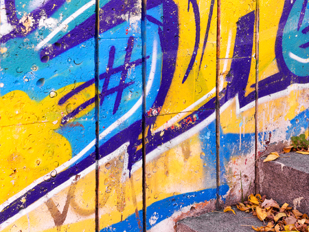 VARNA - NOVEMBER 13: Detail of graffiti on the wall of the old building perspective. Grungy concrete surface with cracks, scratches and streaks of paint. November 13, 2015 in Varna, Bulgariaのeditorial素材