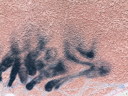 VARNA - 18 November: Detail of graffiti on a concrete wall. Grungy concrete surface with cracks, scratches and streaks of paint. November 18, 2015 in Varna, Bulgariaのeditorial素材