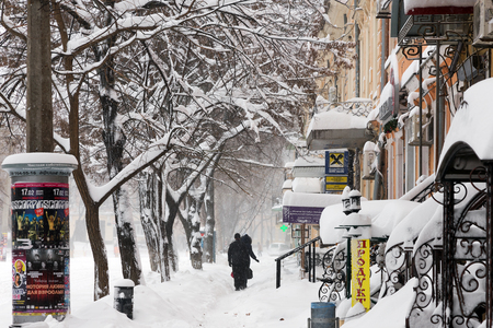 ODESSA - January 18, 2016: On snow-covered street. People go along the street during a snowfall. January 18, 2016 in Odessa, Ukraineのeditorial素材