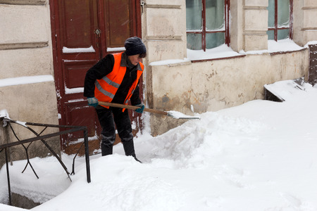 ODESSA - January 18, 2016: On snow-covered street. People go along the street during a snowfall. January 18, 2016 in Odessa, Ukraineのeditorial素材
