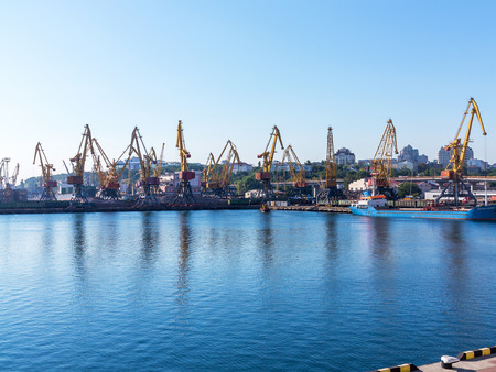 Odessa, Ukraine - August 15, 2016: Container cranes in cargo port terminal, cargo cranes without job...