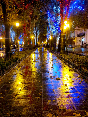 ODESSA, UKRAINE - October 4, 2016: Night city street lamps in the light of a rainy day. Creative blur. Dynamic city night scene of October 4, 2016 in Odessaのeditorial素材