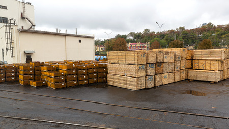 Odessa, Ukraine - October 13, 2016: Industrial products, raw materials, timber and sheet steel mill in the industrial port quay shopping ready for loading cargo seagoing vesselsのeditorial素材