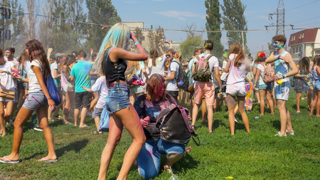 ODESSA, UKRAINE - August 5, 2017: Young people, boys and girls have fun doing selfie during festival of Holi by throwing coloured powder at each other. Festival of Colored Paint, of colors love. Color festのeditorial素材