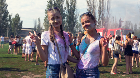ODESSA, UKRAINE - August 5, 2017: Water festival. Party wet. Hands and happy people crowd partying under rain at holi fest, festival of colors in summer, amazing moment. Color festのeditorial素材