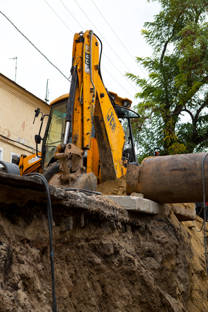ODESSA, UKRAINE - OCTOBER 11, 2016: Repair of city water supply. Replacement of old rusty metal pipes on plastic pipes. New modern technologies of urban engineering networks. City Water Pipelineのeditorial素材