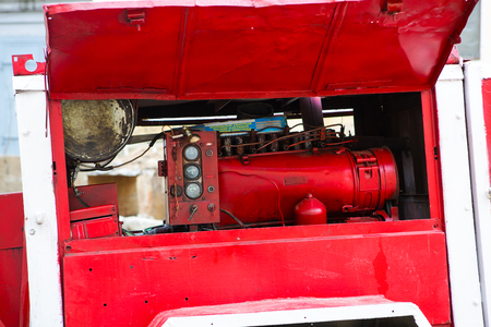 Old diesel generator with oil stains. Vintage engine. Trailer with the old diesel compressor. Mobile...