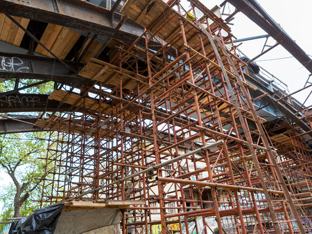 Bridge repair. Metallicheskie support of the bridge. Carried out scheduled repair work on the reconstruction of the old town bridge.のeditorial素材