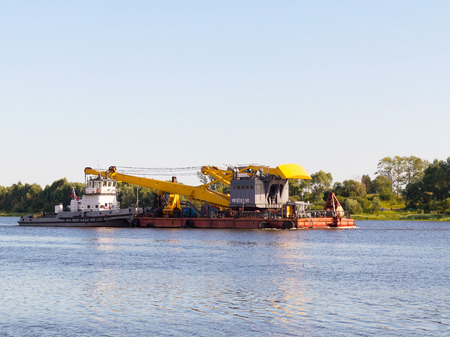 Kasimov, Russia - July 24, 2015: Barge goes along Oka River near town of Kasimov on summer day.のeditorial素材