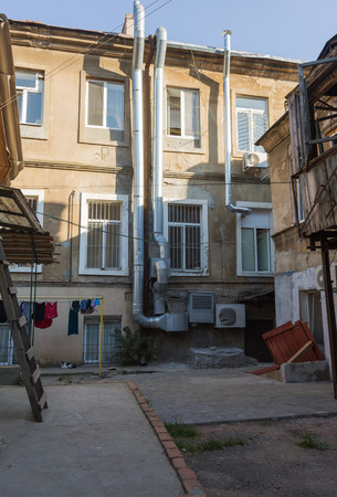 A colorful landscape of ruined houses in a poor neighborhood for poor people. Construction of a poor state. , Architecture of the poor neighborhood. An old house in the area of smellsのeditorial素材