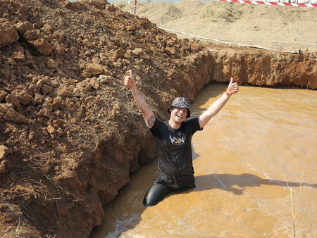 ODESSA, UKRAINE - AUGUST 18, 2018: Participants of the race at the city endurance sports competitions. Running with obstacles. Lovers of extreme sports, active recreation and healthy lifestyle.のeditorial素材