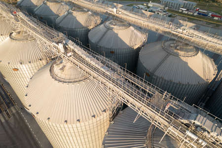 Odessa, Ukraine - August 14, 2021: Grain terminals of modern sea commercial port. Silos for storing...
