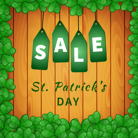 Sale poster of Saint Patrick's day with shamrock on wooden background and hanging green tags. Vector illustrationのイラスト素材