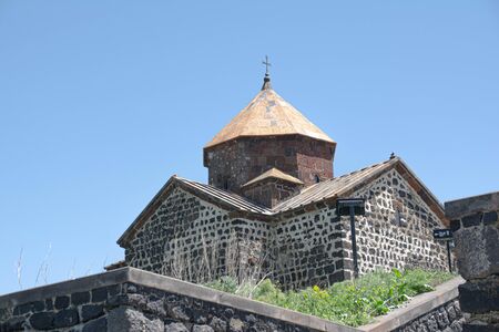 The monastery complex with the churches of St. Arakelots and st. Astvatsatsin on the shore of Lake...