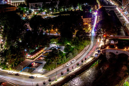 Night city from a bird's eye view. Beautiful night city landscape. Lights are on in all the houses....