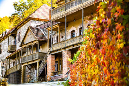 Old architecture of houses. Stone house and wooden cottage. A beautiful place to live. Beautiful...