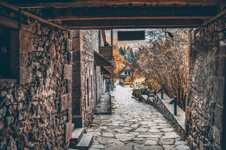 Old architecture of houses. Stone house and wooden cottage. A beautiful place to live. Beautiful architecture of housesの写真素材