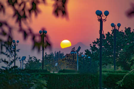 Fantastic sunset and red sky. The sun goes over the mountain. Burning skyの写真素材