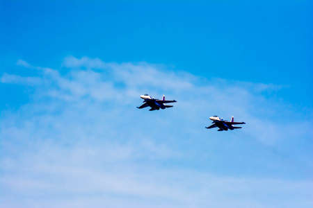 The warplane is flying. Fighter in the sky. Flight of the Su-30 bomber in the sky. Aviation - air force of the Russian Federationの写真素材
