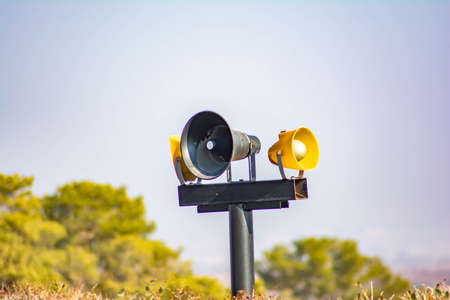 Multi-colored loudspeaker and blue sky. Three loudspeakersの写真素材