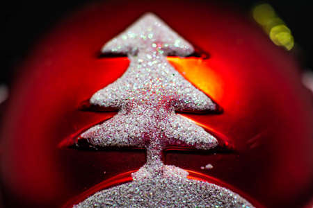 Christmas tree and toys. Red Christmas toy and Christmas tree on itの写真素材