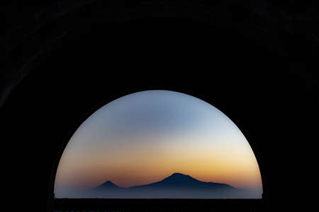 Tunnel and mountain. Beautiful view with sunrise and mountain through the tunnelの写真素材