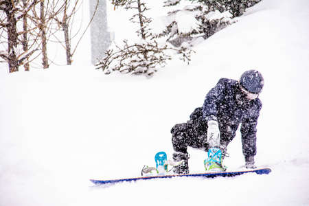 The snowboarder fell during the descent. Winter sports snowboardingの写真素材