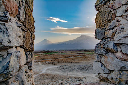 The old walls of the house and the beautiful Mount Ararat. mountain view through the window