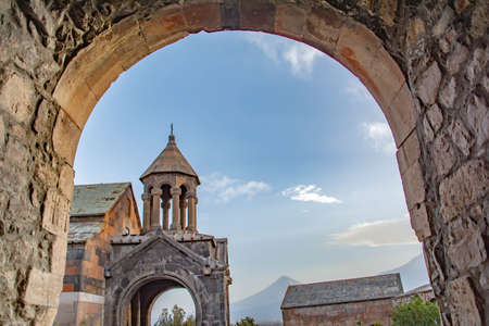 Church through the arches. religious cultural heritage. Old walls, arch and churchの写真素材