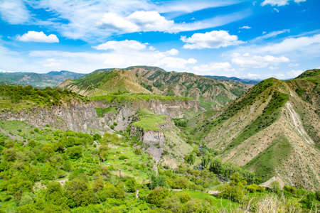 Green fields and mountains. Fascinating nature with unique mountains and rocksの写真素材