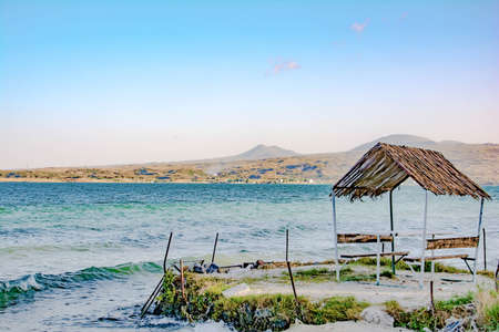 Arbor by the sea. Blue waves of the sea and a gazebo. Holidays at seaの写真素材
