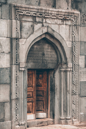 monastery courtyard. Entrance to the church. Beautiful temple architecture Old wooden door.