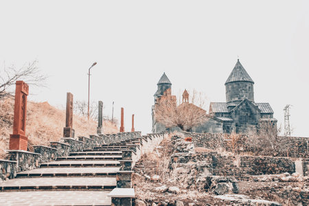 Stairs lead to the monastery. Khachkars and church. Armenian Church of Tegherの写真素材