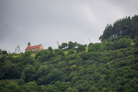 Church on top of the mountain. Green forests and monasteryの写真素材