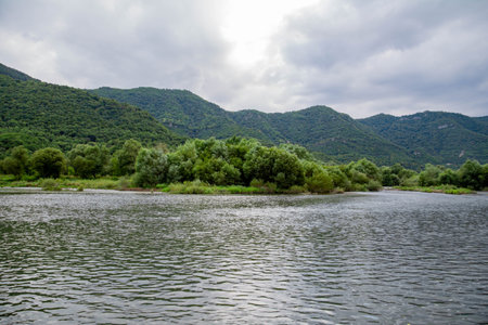 Landscape of the river on a cloudy day in the mountains.