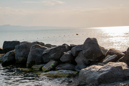 rocks in the sea at sunset, beautiful photo digital picture.の写真素材