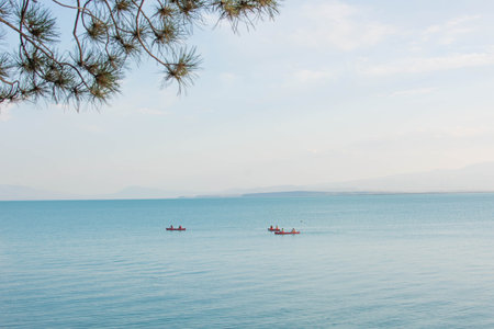 Fishing boats in the sea on the background of the mountains.の写真素材