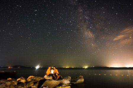 Night sky with stars and milky way over the lake. milky way.の写真素材