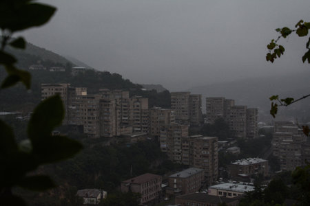 view of the city from the top of the mountain in the fogの写真素材