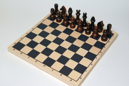Chessboard and chess pieces on a white background, close-upの写真素材