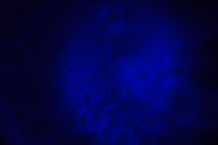 abstract dark blue background texture with some smooth lines and spots in itの写真素材