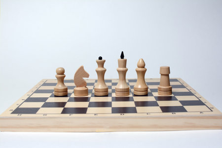 Chess pieces on a chessboard isolated on a white background.の写真素材
