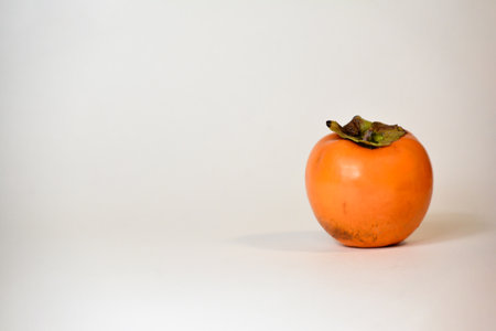 Persimmon fruit on white background, selective focus, copy spaceの写真素材